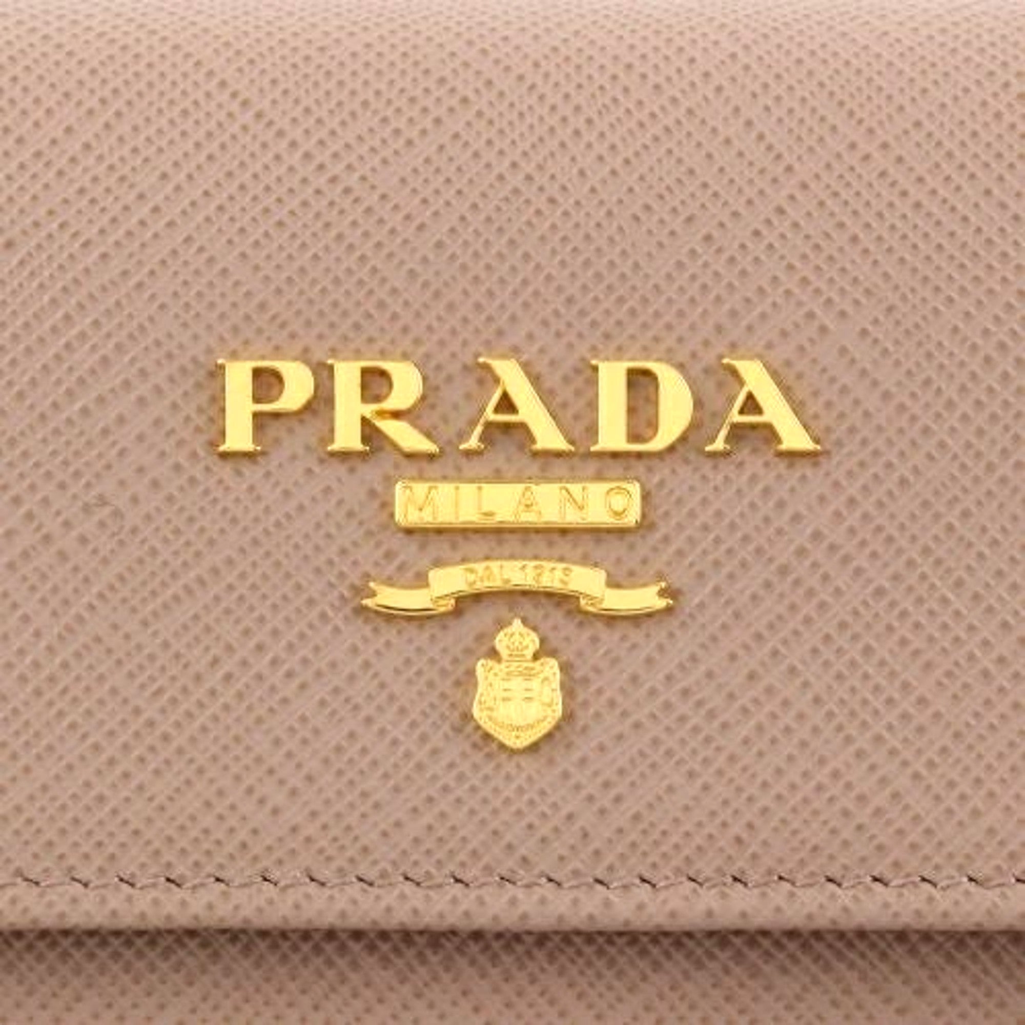 Prada Saffiano Leather Trifold Coin Zipper Card Snap Wallet Cipria Beige available at Queen Bee of Beverly Hills