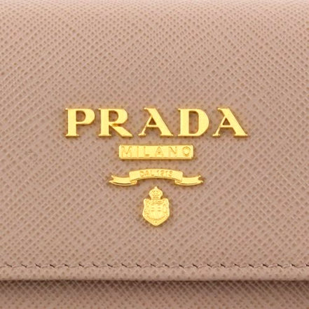 Prada Saffiano Leather Trifold Coin Zipper Card Snap Wallet Cipria Beige available at Queen Bee of Beverly Hills
