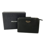 Prada Soft Calfskin Nero Black Leather Small Snap Wallet with Zipper available at Queen Bee of Beverly Hills
