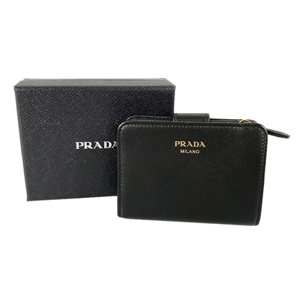 Prada Soft Calfskin Nero Black Leather Small Snap Wallet with Zipper available at Queen Bee of Beverly Hills