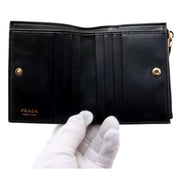 Prada Soft Calfskin Snap Bifold Zip Coin Pocket Wallet Black - available at Queen Bee of Beverly Hills. 