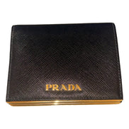 Prada Saffiano Leather Gold Metal Trim Snap Bifold Wallet Black available at Queen Bee of Beverly Hills