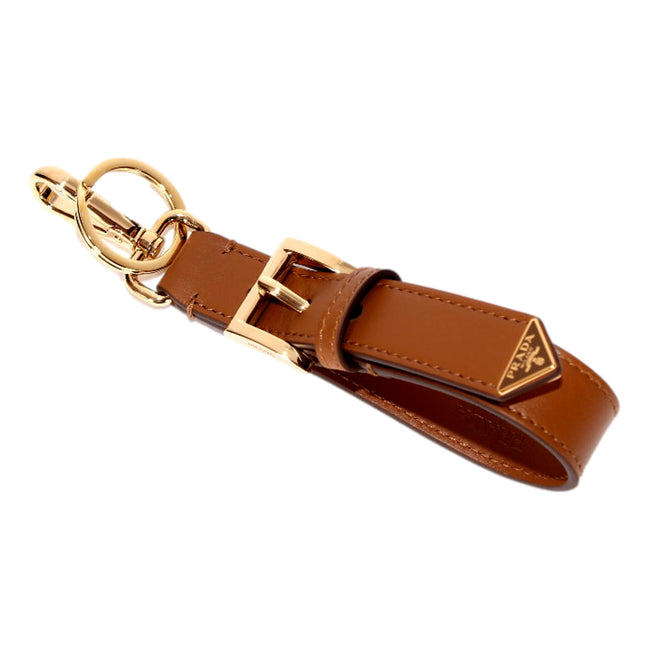 Prada Smooth Leather Belt Strap Keychain Bag Charm in Caramel Brown - available at Queen Bee of Beverly Hills. 