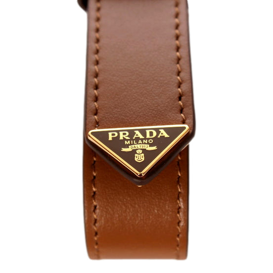 Prada Smooth Leather Belt Strap Keychain Bag Charm in Caramel Brown - available at Queen Bee of Beverly Hills. 