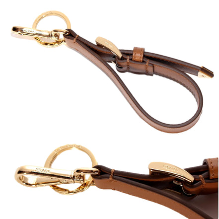 Prada Smooth Leather Belt Strap Keychain Bag Charm in Caramel Brown - available at Queen Bee of Beverly Hills. 