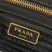 Prada Black Canvas Jacquard Logo Leather Trim Small Satchel available at Queen Bee of Beverly Hills