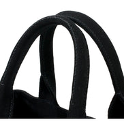 Prada Canapa Tote Handbag Canvas Embossed Lettering Logo Fabric Black available at Queen Bee of Beverly Hills