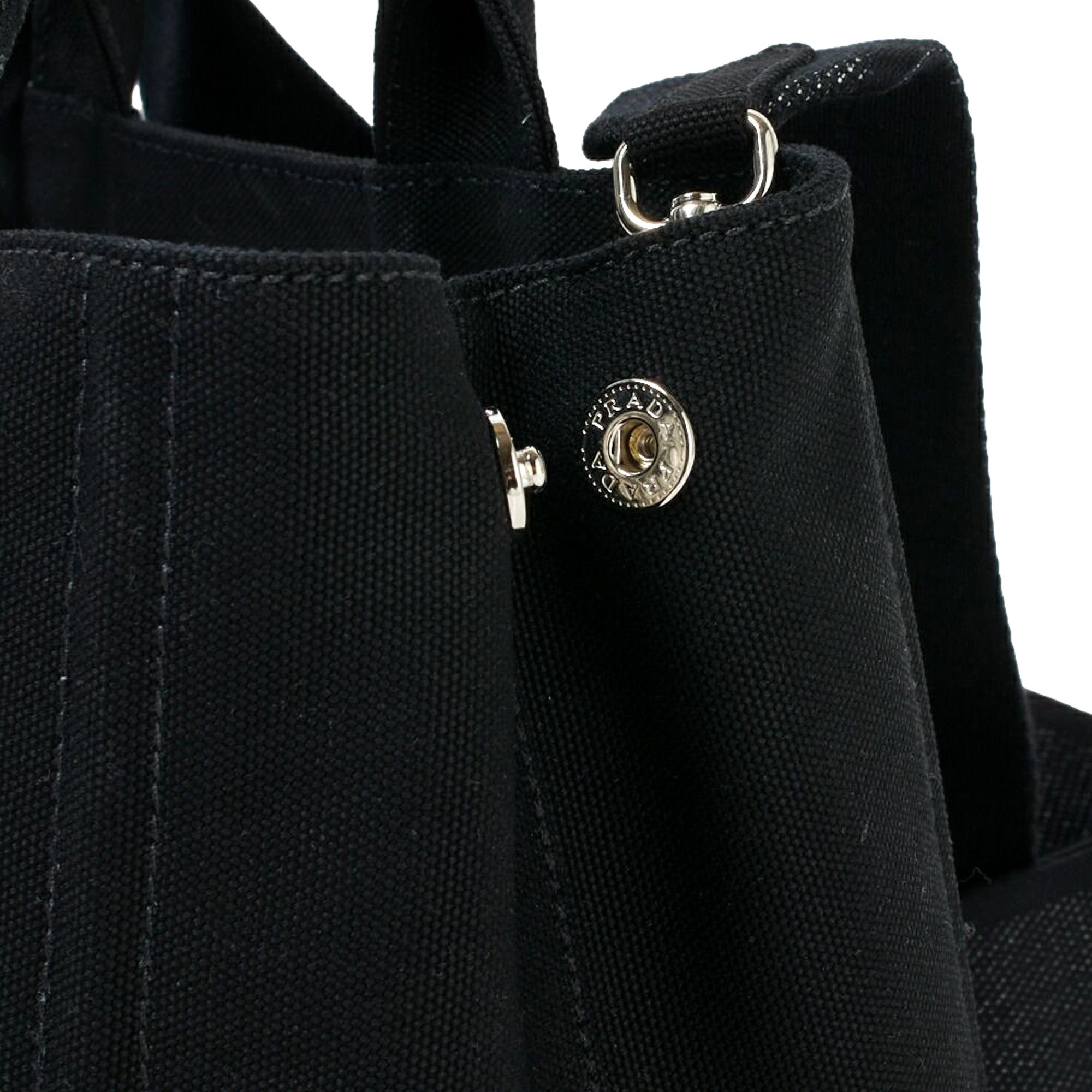 Prada Canapa Tote Handbag Canvas Embossed Lettering Logo Fabric Black available at Queen Bee of Beverly Hills