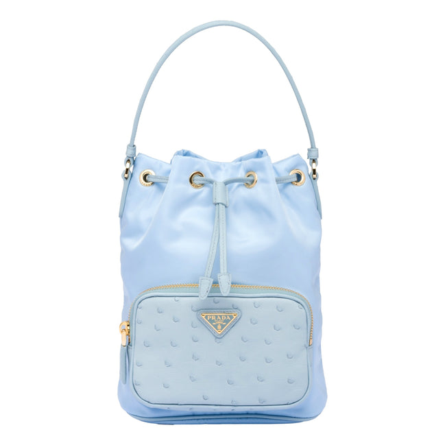 Prada duet orstrich leather and nylon bucket bag in blue available at Queen Bee of Beverly Hills