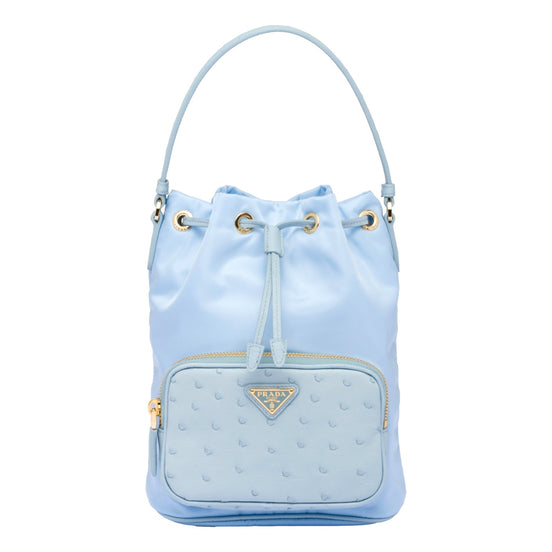 Prada duet orstrich leather and nylon bucket bag in blue available at Queen Bee of Beverly Hills