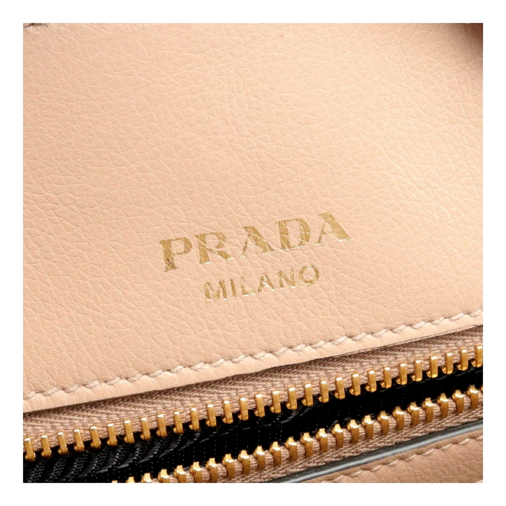 Prada Embossed Logo Soft Leather Handbag Shopper Tote Cammeo Beige available at Queen Bee of Beverly Hills