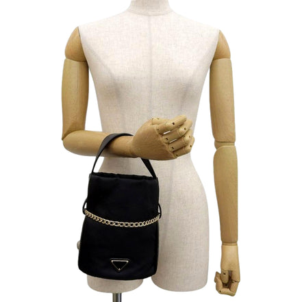 Prada Petit Sac Noir Mini Re-Nylon and Nappa Leather Bucket Bag Black - availablel at Queen Bee of Beverly Hills. 
