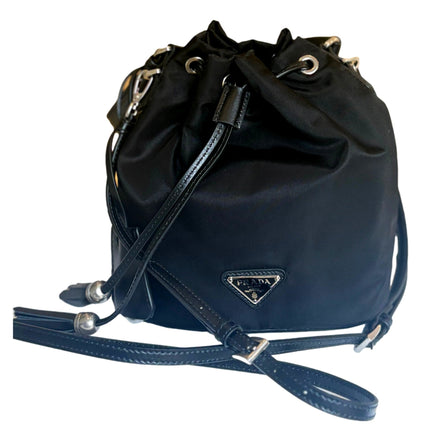 Prada Re-Nylon Black Tassel Drawstring Bucket Bag available at Queen Bee of Beverly Hills