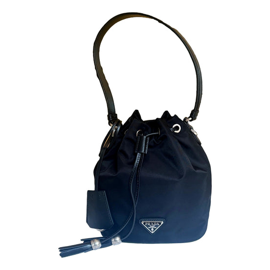 Prada Re-Nylon Black Tassel Drawstring Bucket Bag available at Queen Bee of Beverly Hills