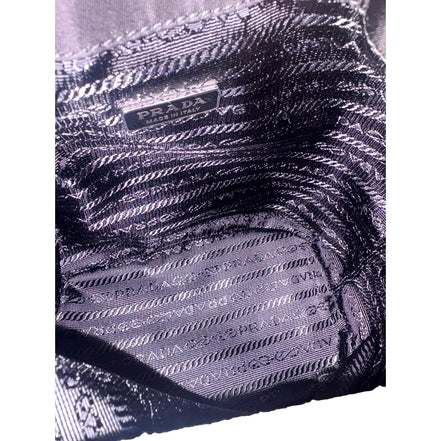 Prada Re-Nylon Black Tassel Drawstring Bucket Bag available at Queen Bee of Beverly Hills