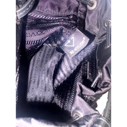 Prada Re-Nylon Black Tassel Drawstring Bucket Bag available at Queen Bee of Beverly Hills