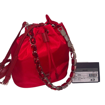 Prada Re-Nylon Rosso Red Drawstring Bucket Bag Embellished Crystal Handle available at Queen Bee of Beverly Hills