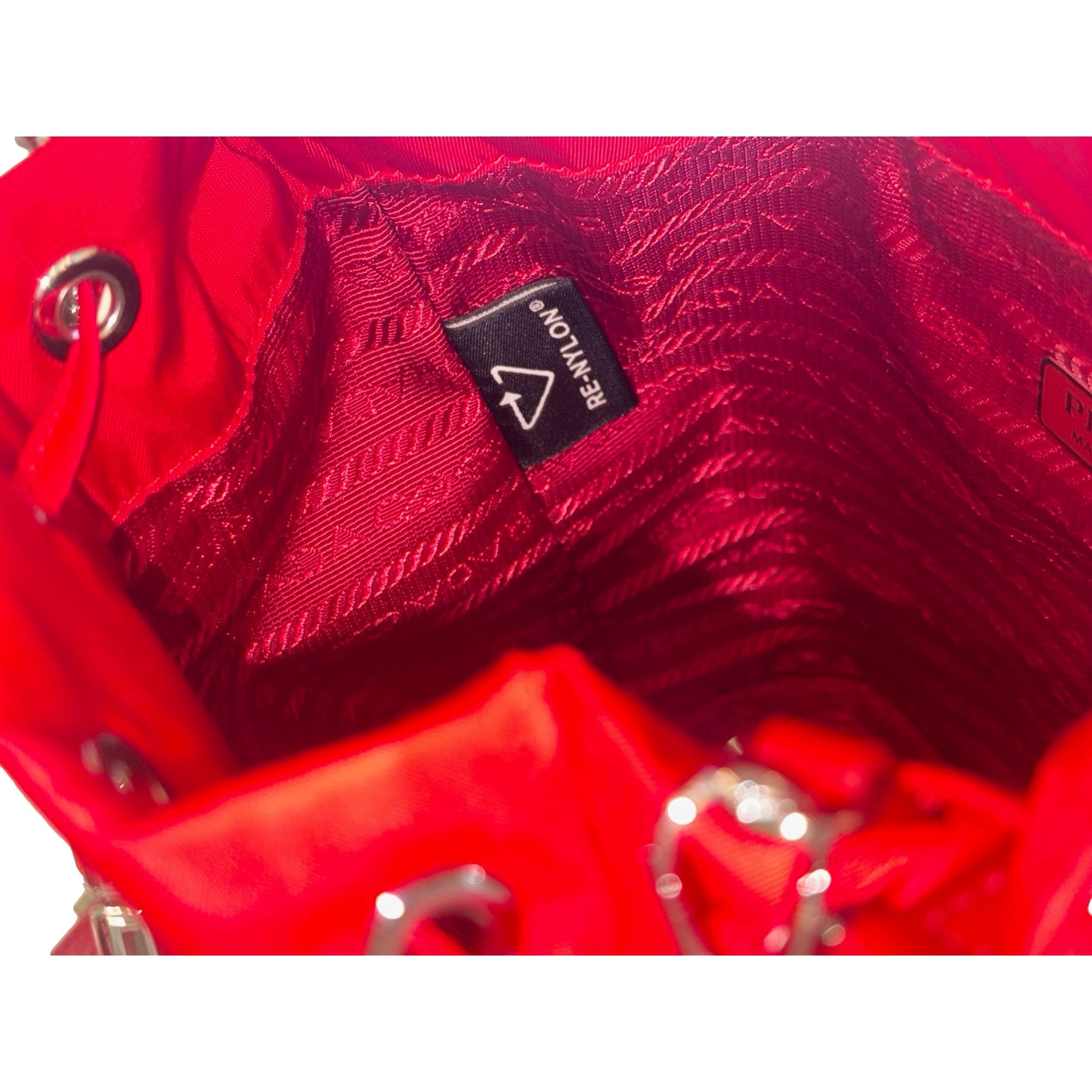Prada Re-Nylon Rosso Red Drawstring Bucket Bag Embellished Crystal Handle available at Queen Bee of Beverly Hills