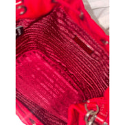 Prada Re-Nylon Rosso Red Drawstring Bucket Bag Embellished Crystal Handle available at Queen Bee of Beverly Hills