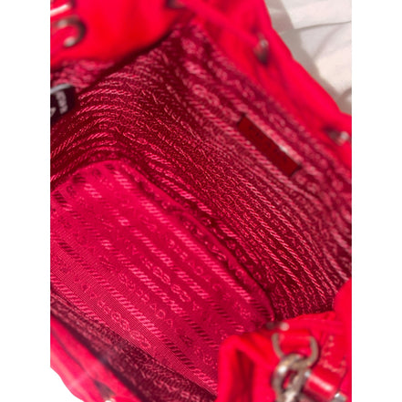 Prada Re-Nylon Rosso Red Drawstring Bucket Bag Embellished Crystal Handle available at Queen Bee of Beverly Hills