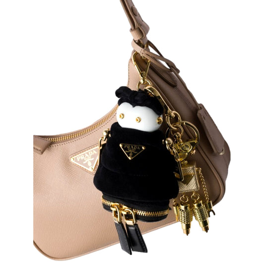 Prada Black Nylon Robot Keychain Bag Charm with Gold Tone Hardware and Strap - available at Queen Bee of Beverly Hills. 