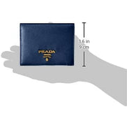 Prada Saffiano Baltico Blue Leather Gold Logo Bifold Snap Wallet available at Queen Bee of Beverly Hills