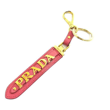 Prada Saffiano Leather Clip Keychain Peony Pink Gold Logo Lettering available at Queen Bee of Beverly Hills