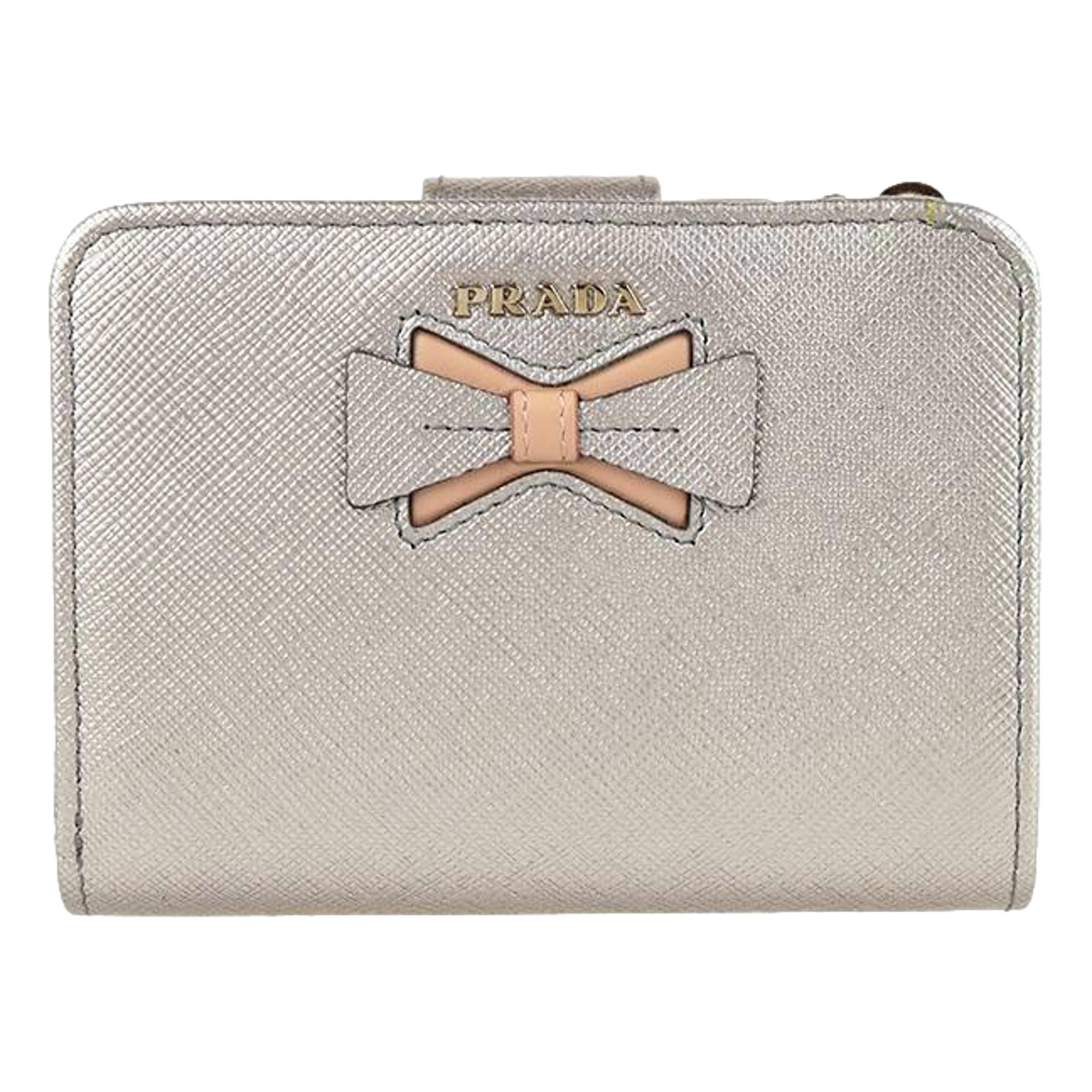 Prada Saffiano Leather Pirite and Cipria Gold Bow Wallet with Zipper Coin Pouch available at Queen Bee of Beverly Hills