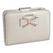 Prada Saffiano Leather Pirite and Cipria Gold Bow Wallet with Zipper Coin Pouch available at Queen Bee of Beverly Hills