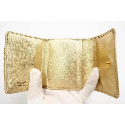 Prada Saffiano Platino Gold Trifold Wallet Card Case with Zipper Coin Pouch available at Queen Bee of Beverly Hills