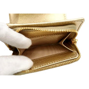Prada Saffiano Platino Gold Trifold Wallet Card Case with Zipper Coin Pouch available at Queen Bee of Beverly Hills