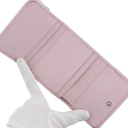 Prada Saffiano Light Pink Leather Wallet Coin Zipper Trifold Triangle Logo sold at Queen Bee of Beverly Hills