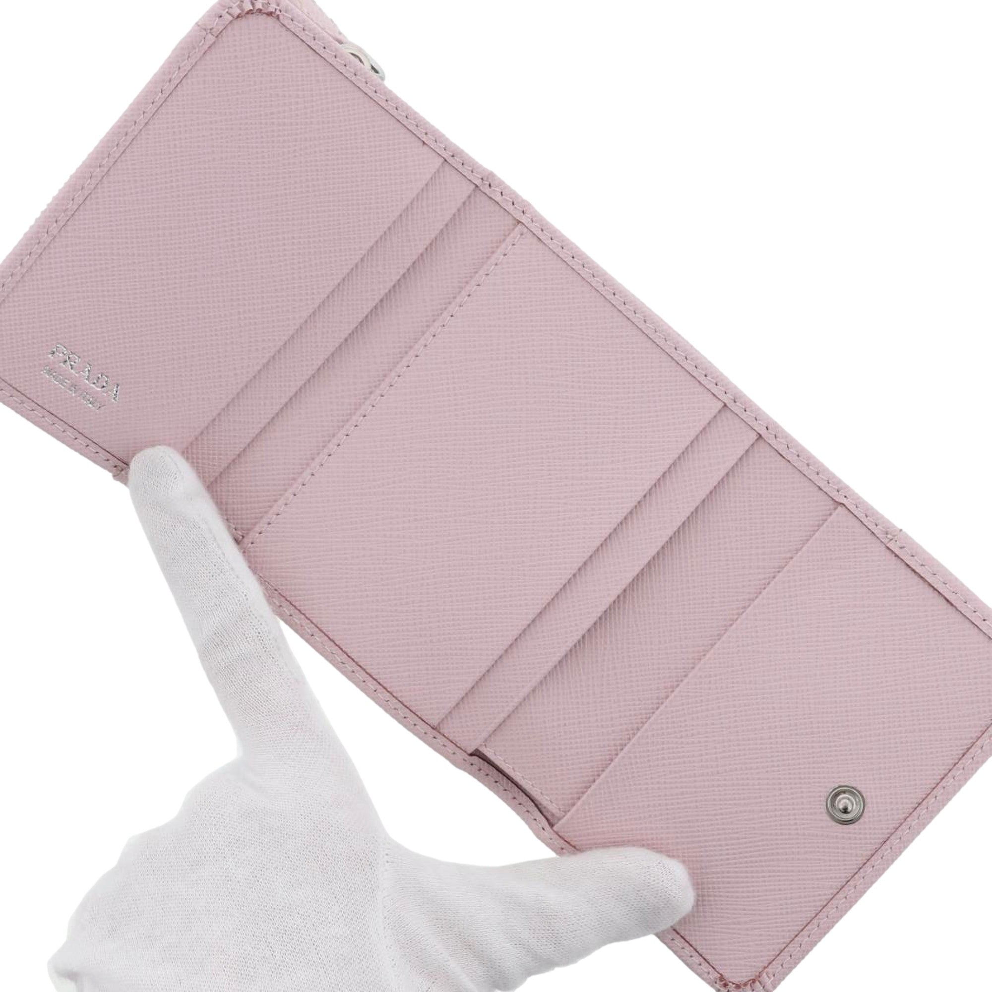 Prada Saffiano Light Pink Leather Wallet Coin Zipper Trifold Triangle Logo sold at Queen Bee of Beverly Hills