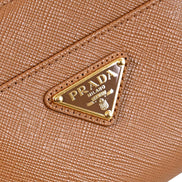 Prada Saffiano Caramel Brown Triangle Logo Zipper Card Holder Wallet sold at Queen Bee of Beverly Hills