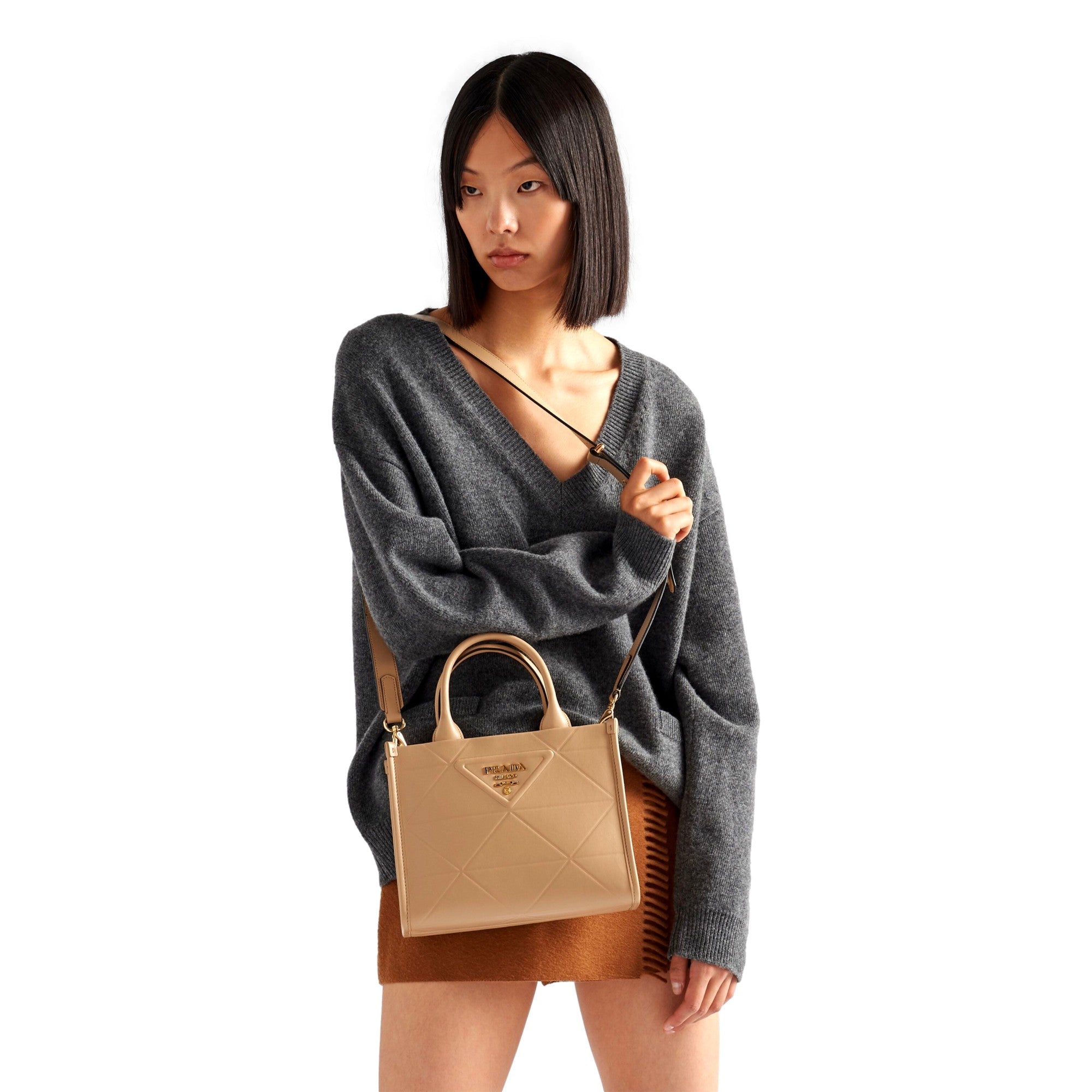 Prada Symbole Soft Calfskin Leather Sabbia Sand Triangle Quilted Mini Tote Bag available at Queen Bee of Beverly Hills