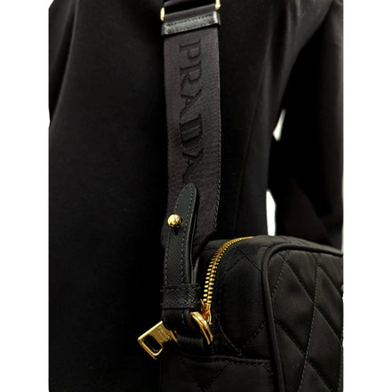 Prada Tessuto Black Quilted Nylon Triangle Logo Camera Crossbody Bag available at Queen Bee of Beverly Hills