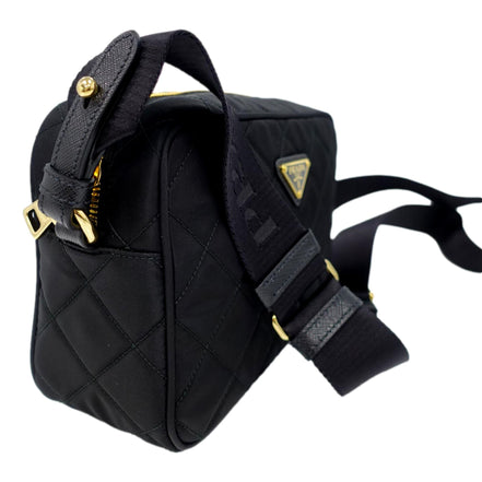 Prada Tessuto Black Quilted Nylon Triangle Logo Camera Crossbody Bag available at Queen Bee of Beverly Hills
