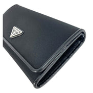 Prada Tessuto Nero Black Continental Flap Black Wallet Silver Triangle Logo available at Queen Bee of Beverly Hills