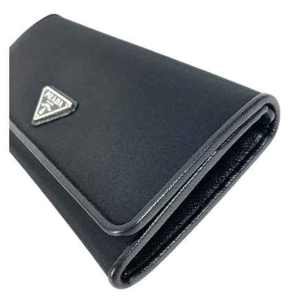 Prada Tessuto Nero Black Continental Flap Black Wallet Silver Triangle Logo available at Queen Bee of Beverly Hills