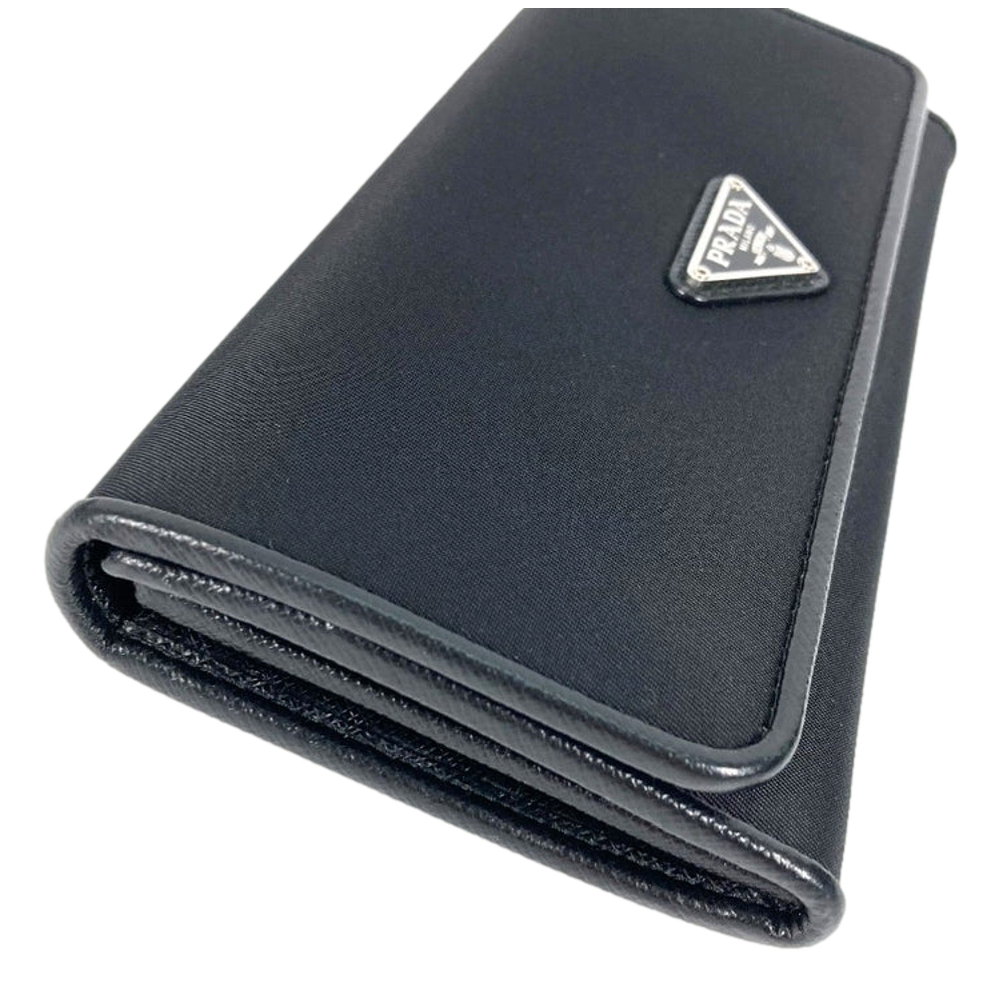 Prada Tessuto Nero Black Continental Flap Black Wallet Silver Triangle Logo available at Queen Bee of Beverly Hills