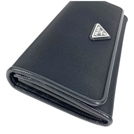 Prada Tessuto Nero Black Continental Flap Black Wallet Silver Triangle Logo available at Queen Bee of Beverly Hills