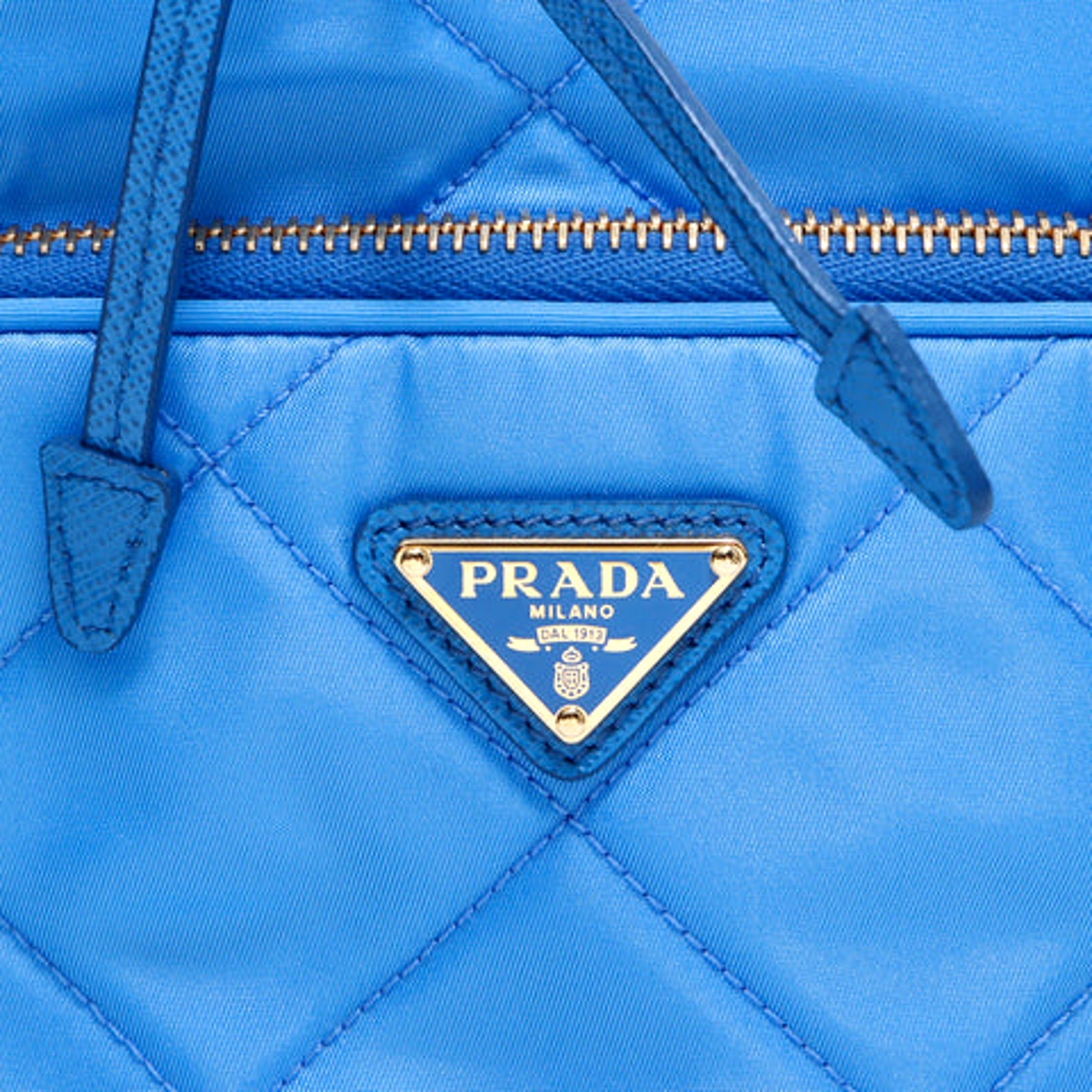 Prada Tessuto Nylon Pervinca Blue Duet Drawstring Quilted Bucket Bag available at Queen Bee of Beverly Hills