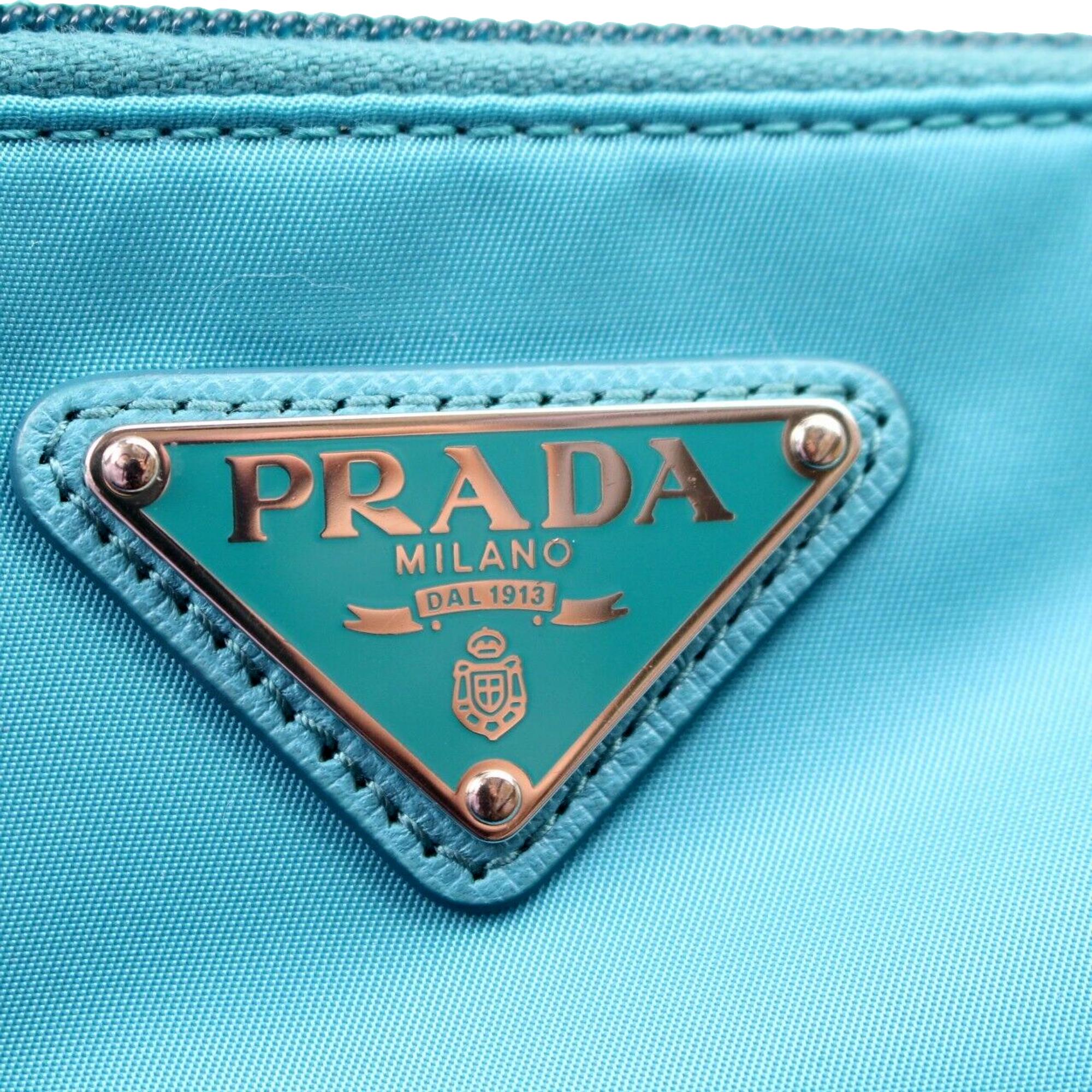 Prada Tessuto Turquoise Nylon Cosmetic Case Wristlet Clutch Bag available at Queen Bee of Beverly Hills