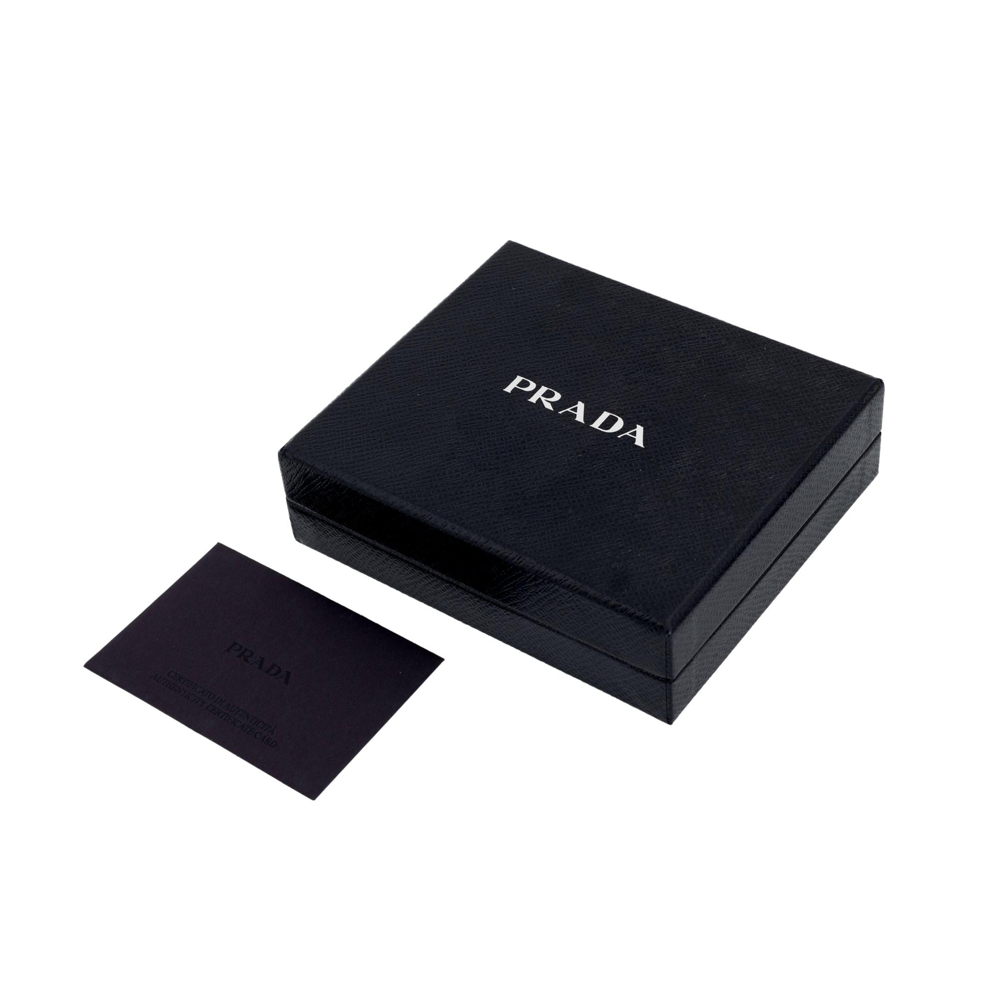 Prada Triangle Plaque Smooth Black Leather Round Mini Pouch Keychain available at Queen Bee of Beverly Hills