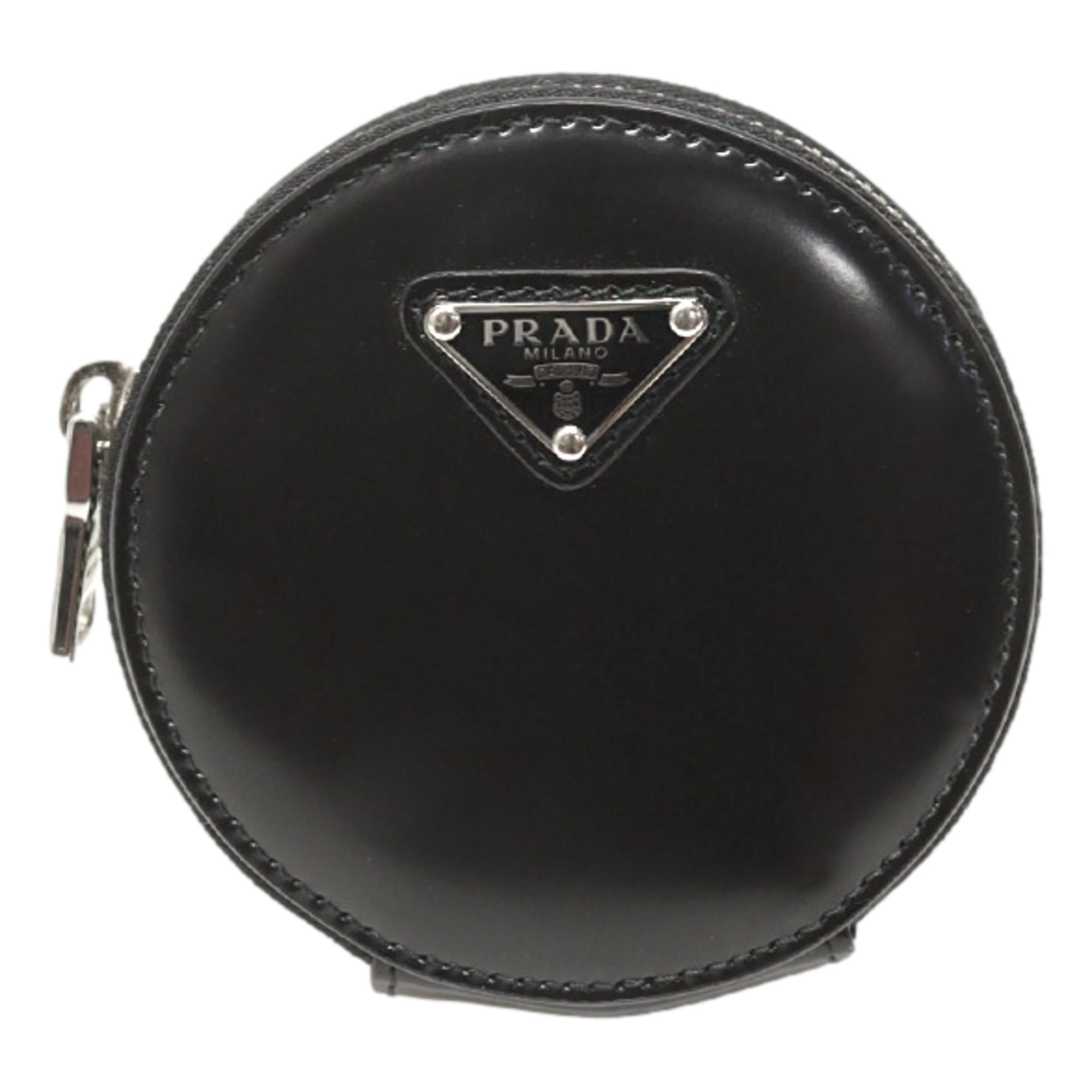 Prada Triangle Plaque Smooth Black Leather Round Mini Pouch Keychain available at Queen Bee of Beverly Hills