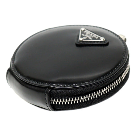 Prada Triangle Plaque Smooth Black Leather Round Mini Pouch Keychain available at Queen Bee of Beverly Hills