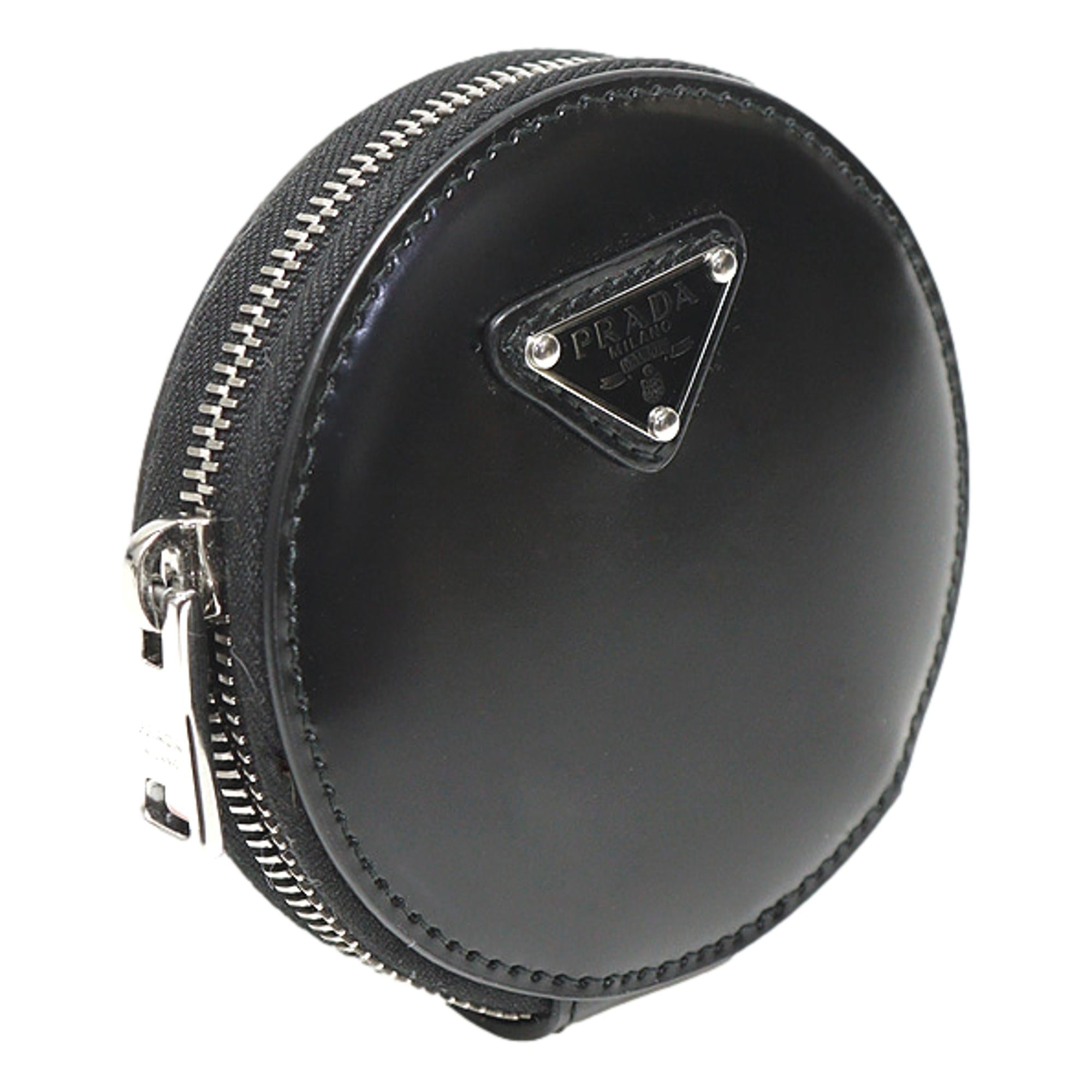 Prada Triangle Plaque Smooth Black Leather Round Mini Pouch Keychain available at Queen Bee of Beverly Hills