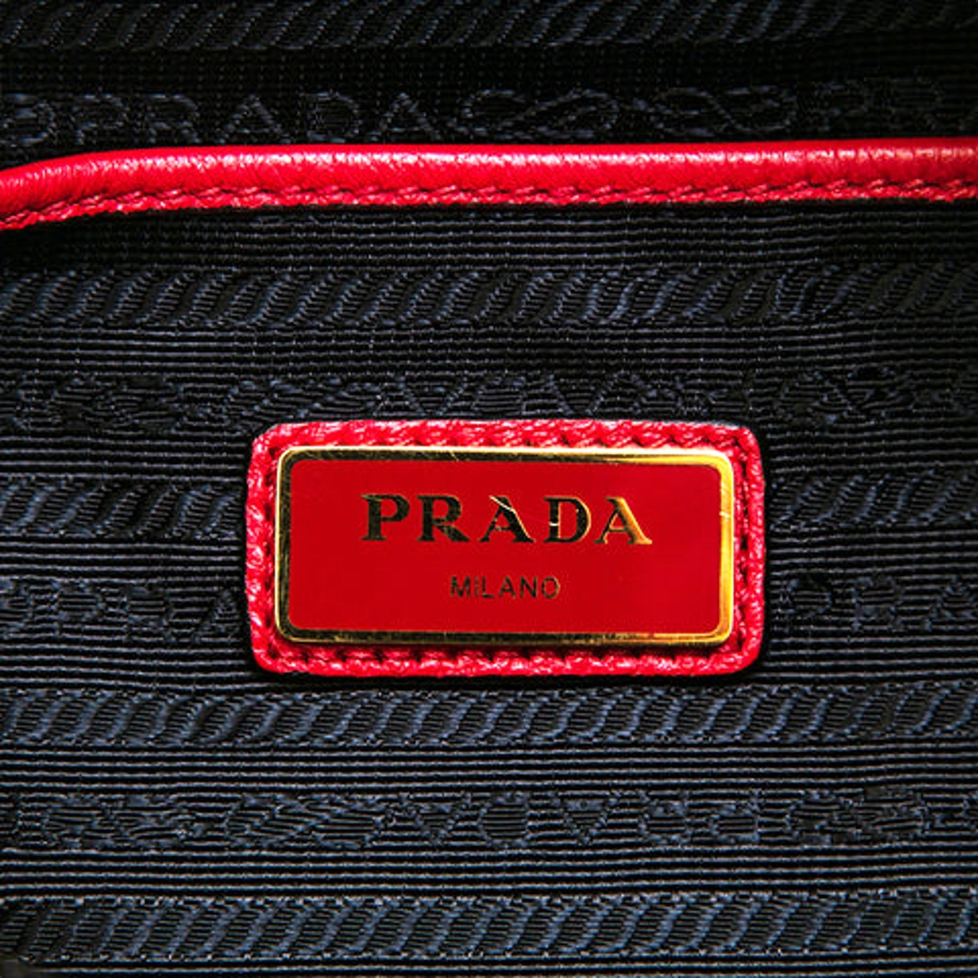 Prada Vitello Daino Convertible Front Pocket Backpack Red Gold Hardware available at Queen Bee of Beverly Hills