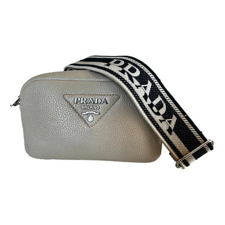 Prada Vitello Daino Leather Sabbia Beige Web Strap Camera Crossbody available at Queen Bee of Beverly Hills