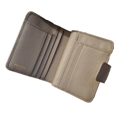 Prada Vitello Grain Argilla Grey Leather Small Wallet with Zipper Gold Plaque Logo available at Queen Bee of Beverly Hills